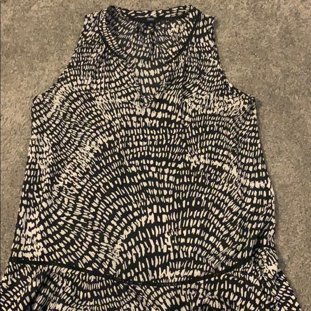 Black and white sleeveless blouse